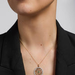 14k gold emerald round trinity knot pendant s46403 on a model 1