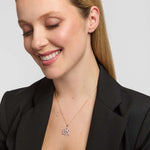 Diamond heart and Celtic knot pendant necklace on model