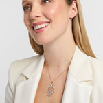 woman showcasing a statement diamond celtic knot necklace made by Solvar