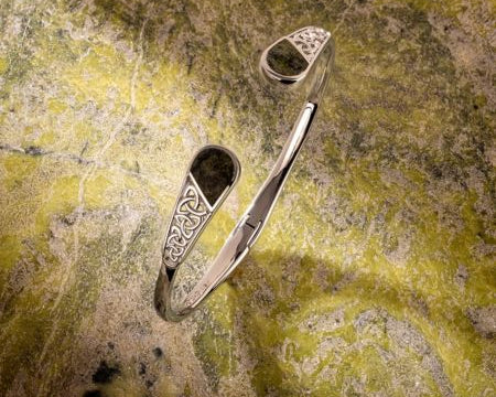 styled image of connemara marble bracelet on green marble background