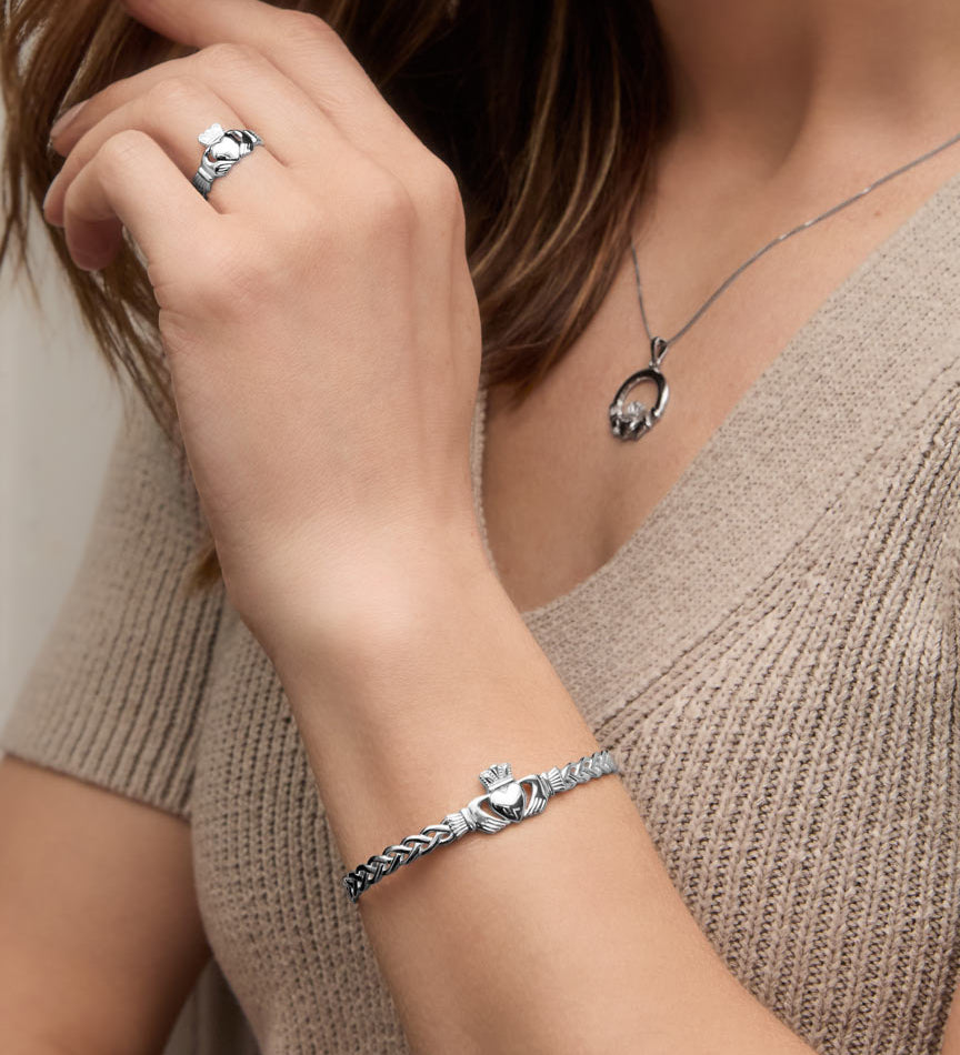 a model wearing celtic claddagh bangle from Solvar