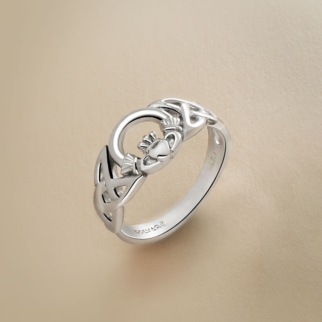close-up image of Solvar Celtic Claddagh ring in silver on a beige background