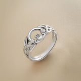 close-up image of Solvar Celtic Claddagh ring in silver on a beige background