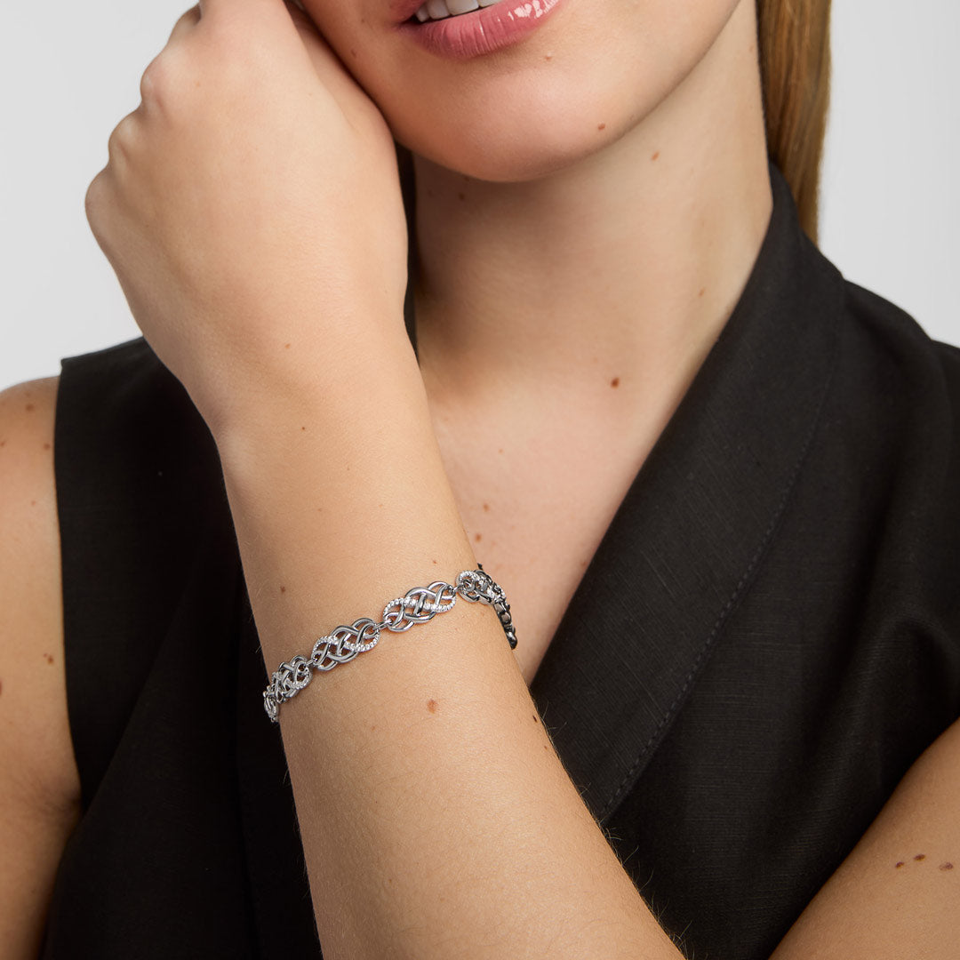close-up image of cz celtic knot link bracelet presented on a female model