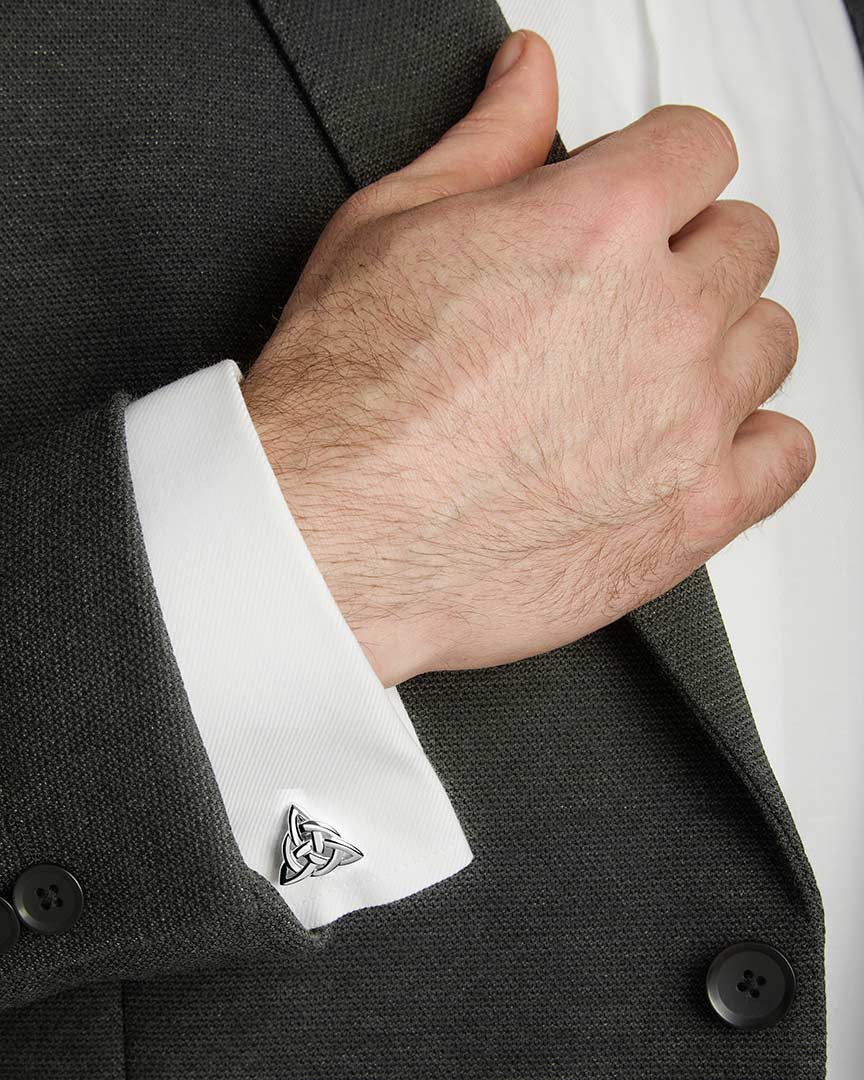 a model wearing silver Celtic Knot cufflinks from Solvar