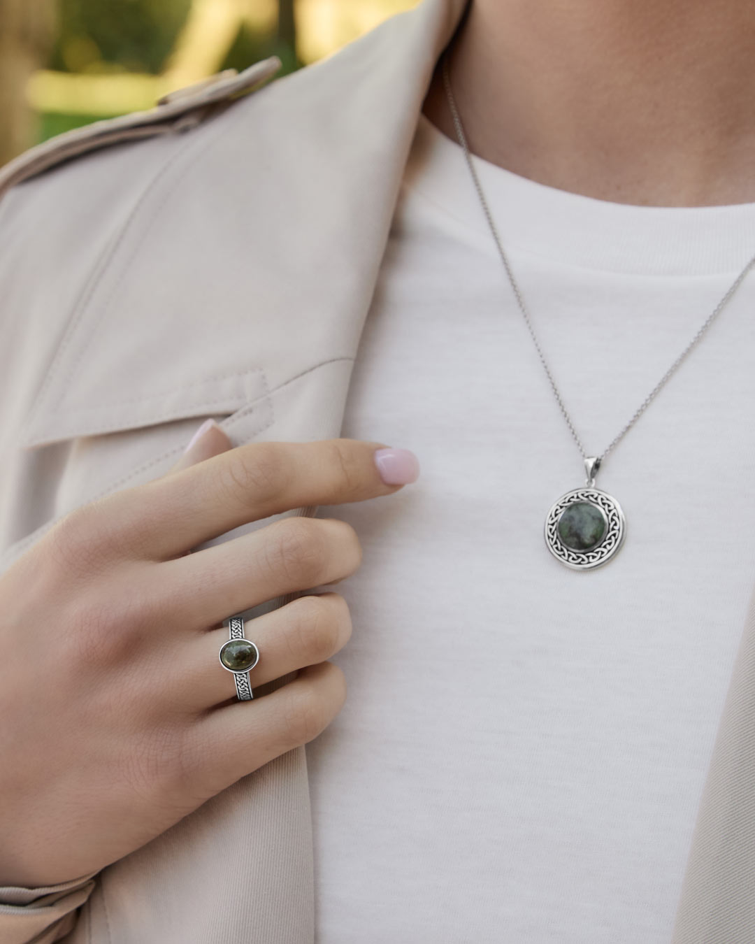 connemara marble celtic knot ring and necklace set on a model