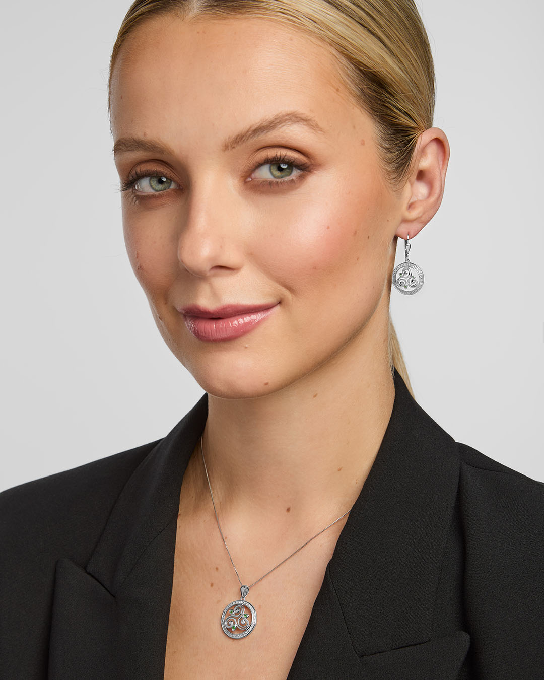 ladies matching celtic spiral necklace and earrings on a model