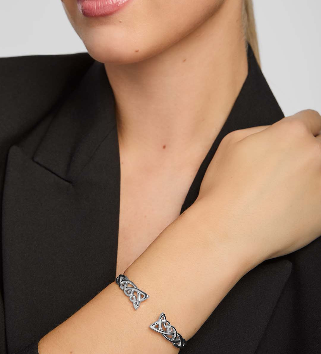 a female model wearing celtic torc bangle in sterling silver