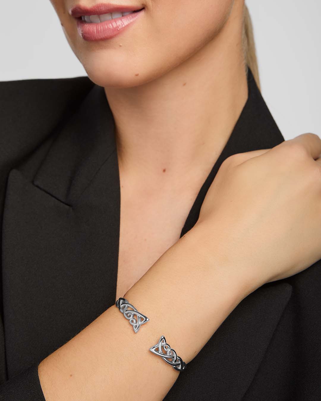 a female model wearing celtic torc bangle in sterling silver
