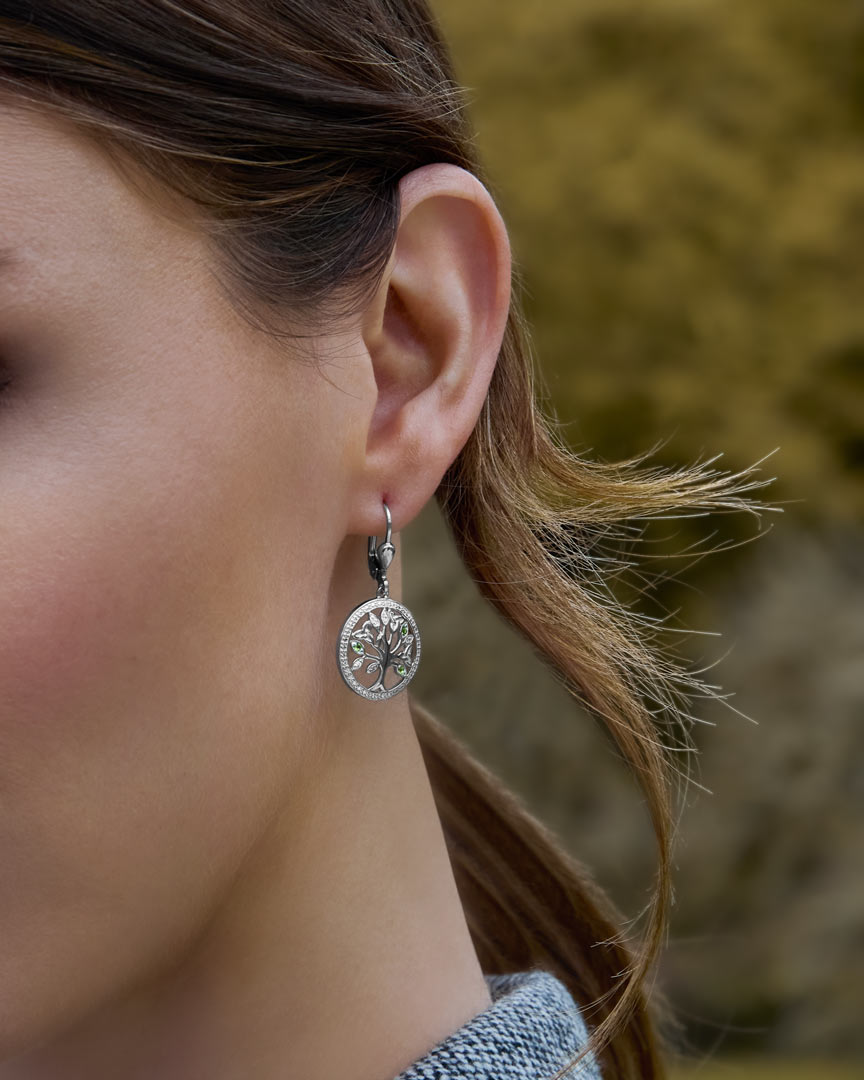a model wearing Irish tree of life drop earrings 