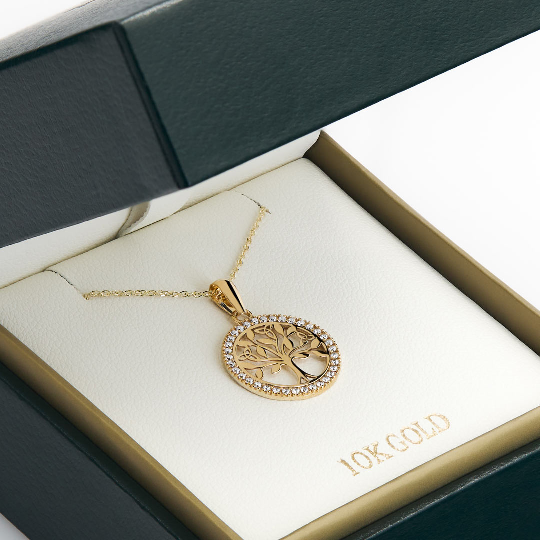 yellow gold celtic cz tree of lie necklace presented in the solvar jewellery box