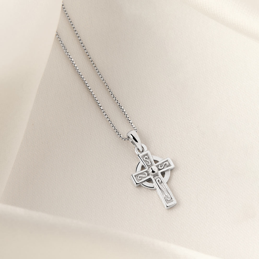 lifestyle image of kid's Celtic Cross necklace in silver