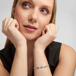 green cz silver claddagh bracelet on a female model