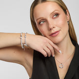  lifestyle shot of Solvar Claddagh tennis bracelet and bangle on a woman's wrist, emphasizing detail and shine