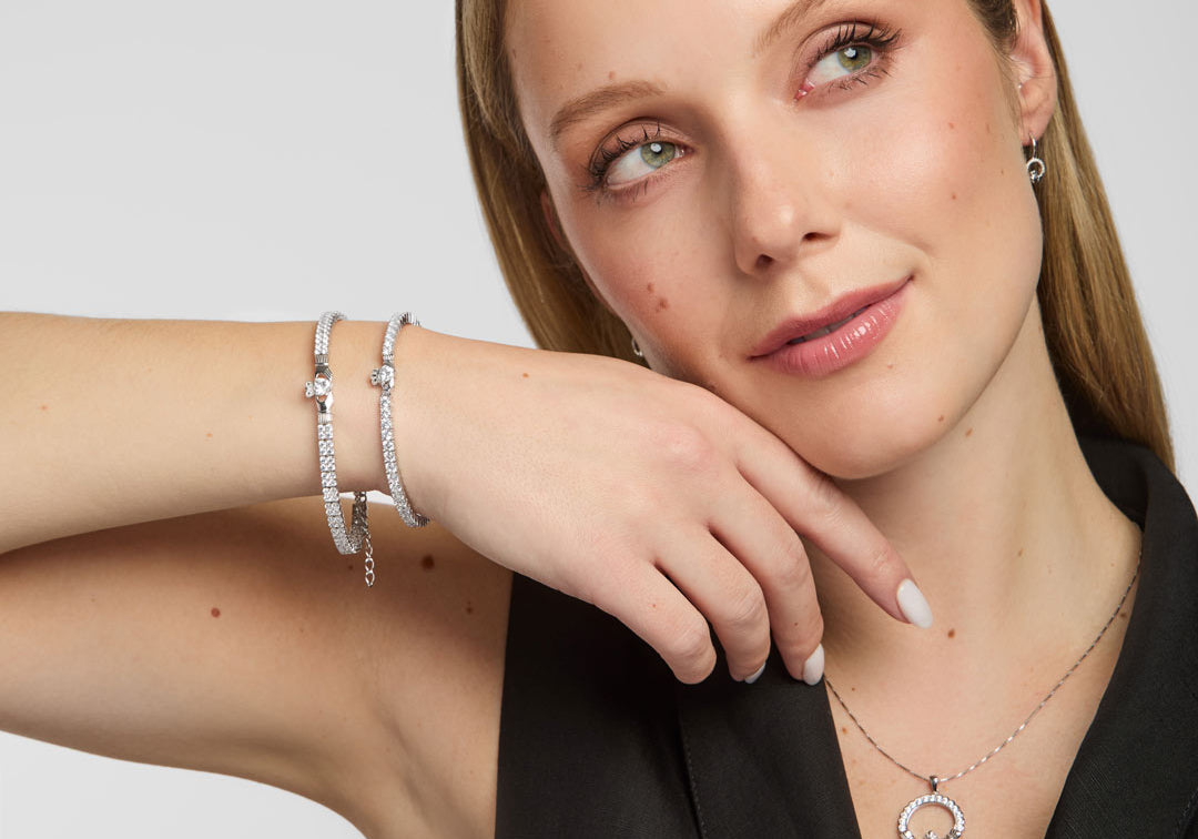  lifestyle shot of Solvar Claddagh tennis bracelet and bangle on a woman's wrist, emphasizing detail and shine