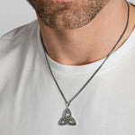 closeup image of men's green marble Celtic Trinity Knot necklace on a model