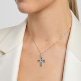 model wearing green marble celtic cross pendant with claddagh symbol in centre