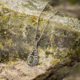 lifestyle image of marble & marcasite celtic necklace on connemara marble background
