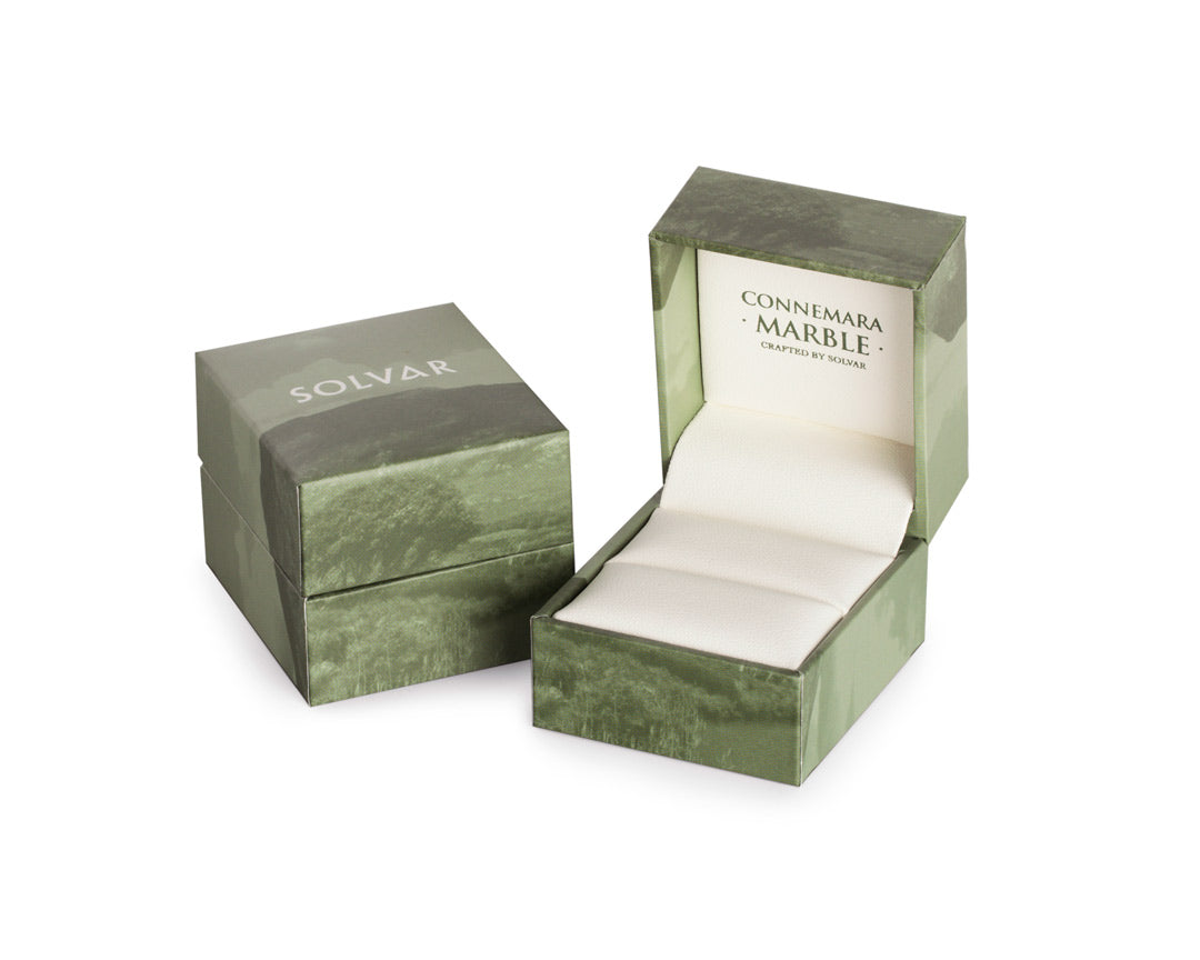 Connemara marble ring box with Solvar logo on it