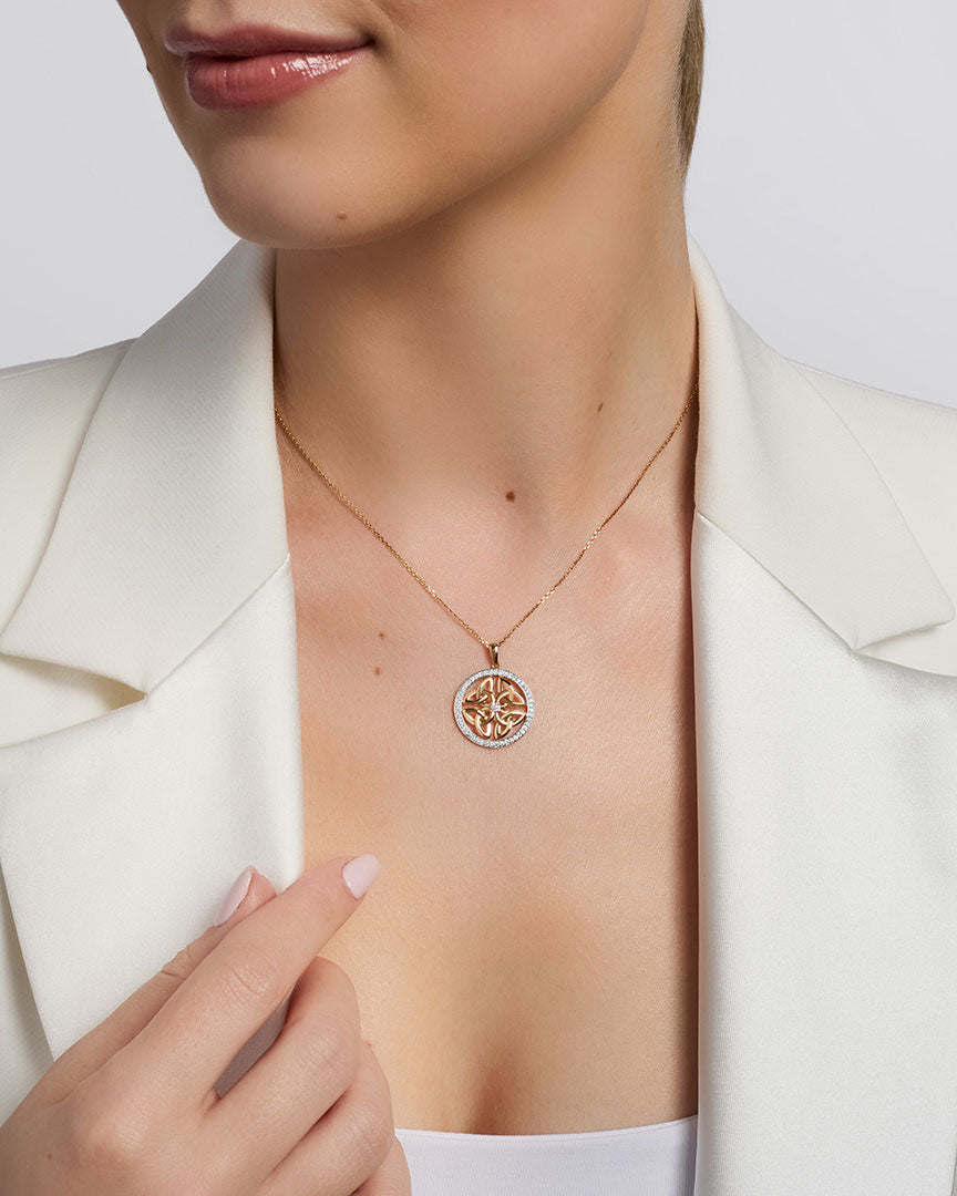 a model wearing celtic four trinity knot necklace