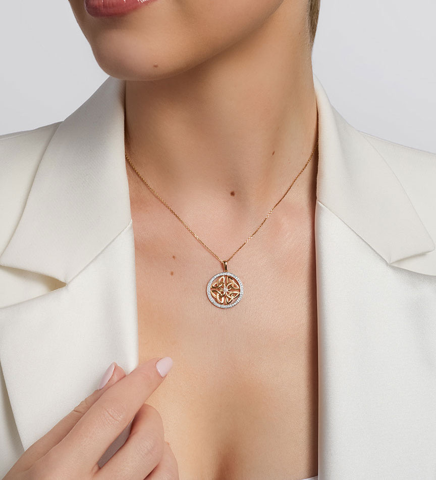 a model wearing celtic four trinity knot necklace
