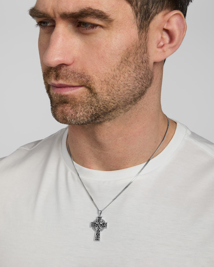 a male model wearing heavy double-sided Celtic Cross pendant from Solvar