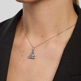 Silver necklace with a double-sided trinity knot pendant on a person wearing a black blazer.
