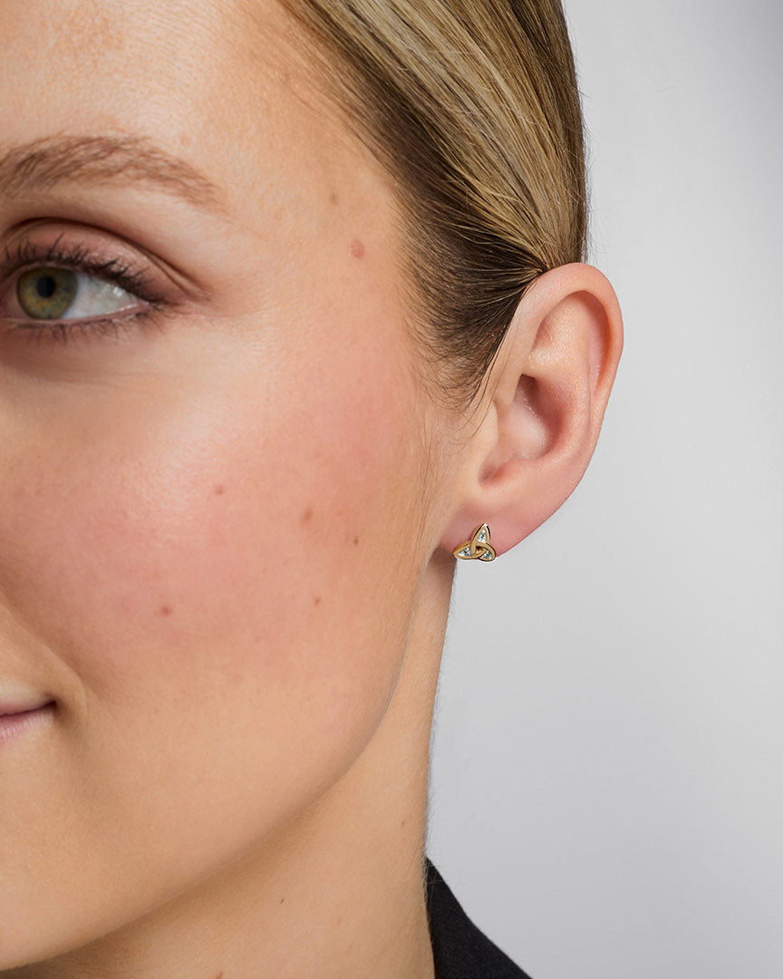 14K gold emerald trinity knot stud earrings s3006 on a model 2