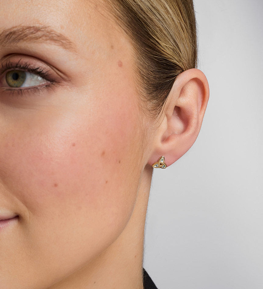 14K gold emerald trinity knot stud earrings s3006 on a model 2