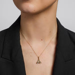 10k gold emerald trinity knot pendant s45717 on a model 2
