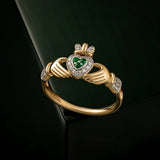 styled image of 14K gold diamond and emerald set claddagh ring s2945 from Solvar