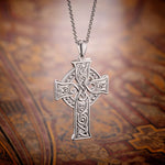lifestyle image of four apostles celtic cross on celtic-pattern background 