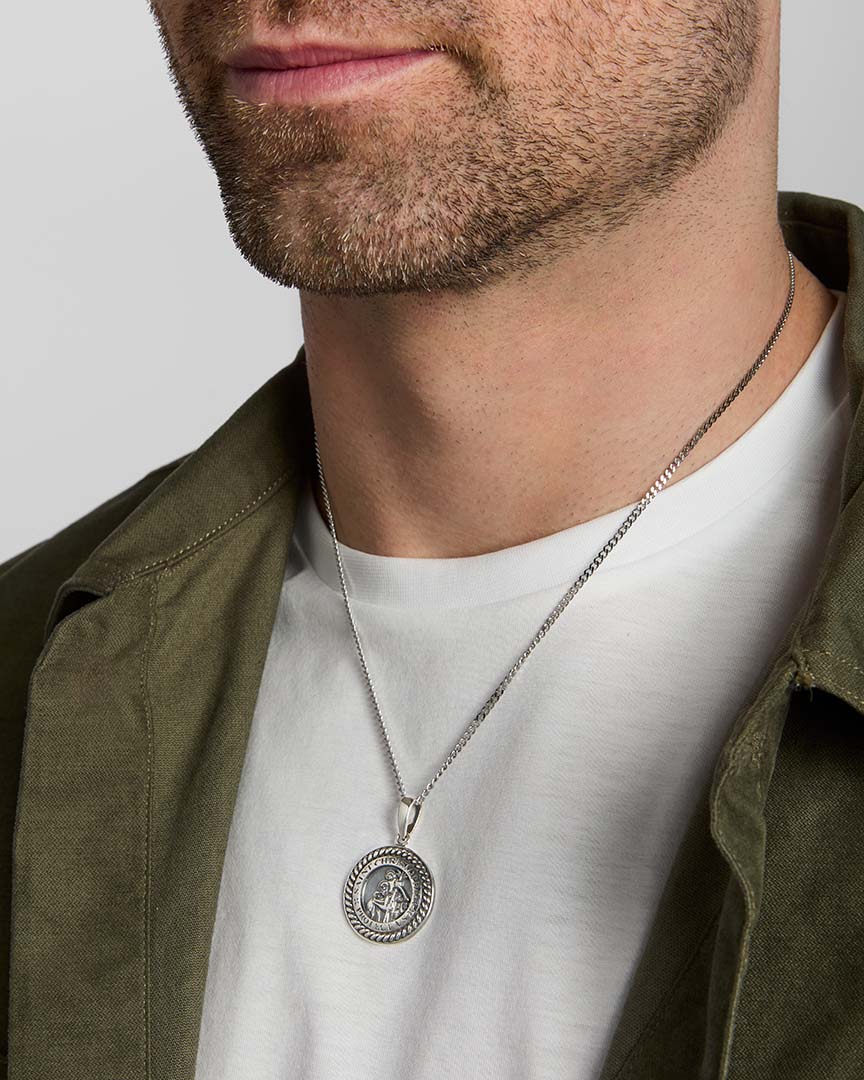male model wearing  silver st Christopher medal pendant from Solvar