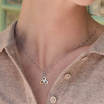 a model wearing gold and silver trinity knot necklace s45347