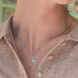a model wearing gold and silver trinity knot necklace s45347