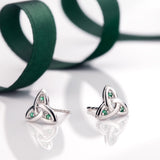 styled image of 14K white gold emerald trinity knot stud earrings s3007 from Solvar