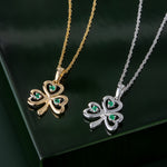 styled image of matching white and yellow gold emerald shamrock pendants