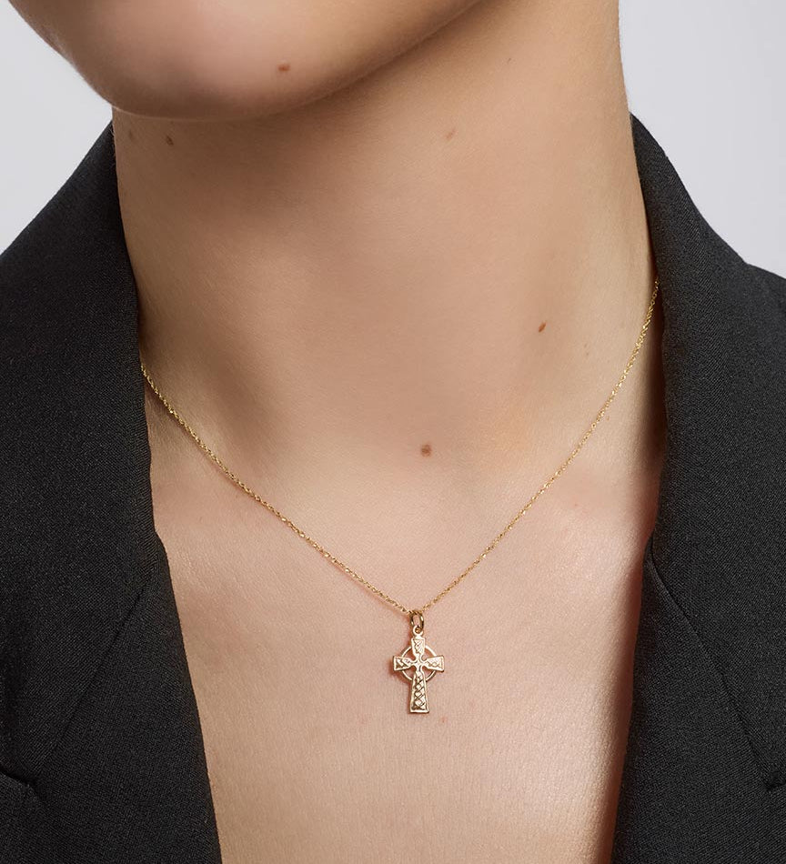 solvar gold small celtic cross pendant on a model