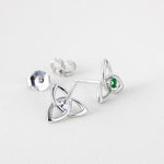 lifestyle image of front and back sides of Solvar green crystal silver trinity knot stud earrings s33767