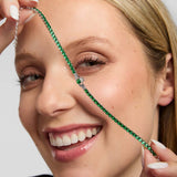 lifestyle image of green cz tennis bracelet with the Claddagh centre from Solvar