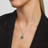 a female model wearing a green crystal Shamrock necklace