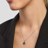 close-up of a female model wearing green Shamrock pendant from Solvar