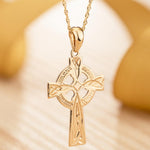 lifestyle image of hand engraved gold celtic cross necklace 1