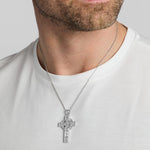 a male model wearing heavy silver celtic cross pendant from Solvar