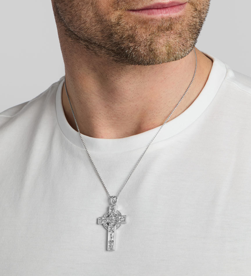 a male model wearing heavy silver celtic cross pendant from Solvar