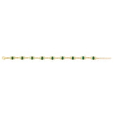 Product shot showing ladies emerald set Trinity Knot tennis bracelet laid out in its open state.