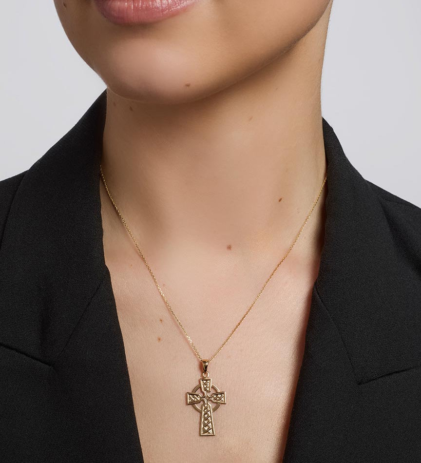 olvar 14k gold large celtic cross pendant on a model