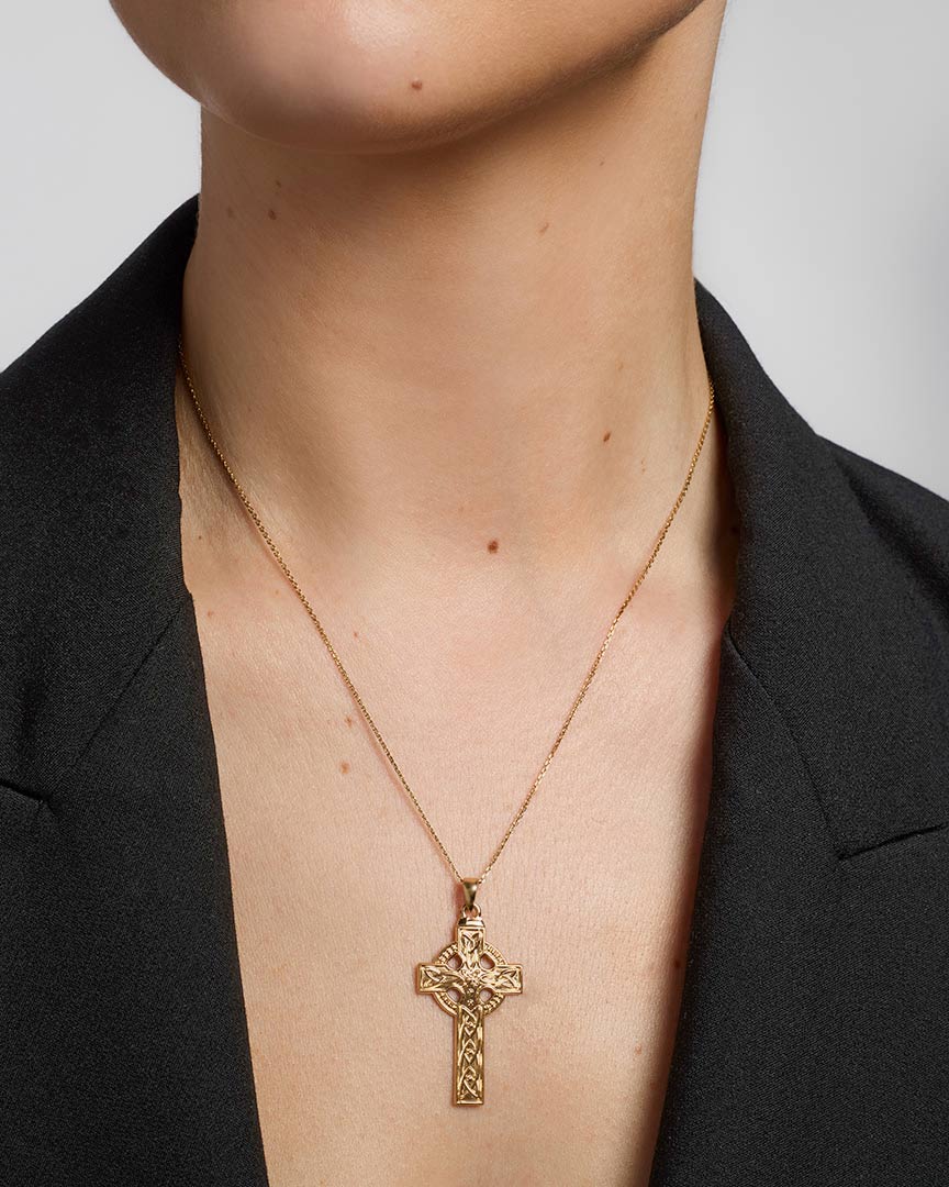  gold large embossed celtic cross on a female model