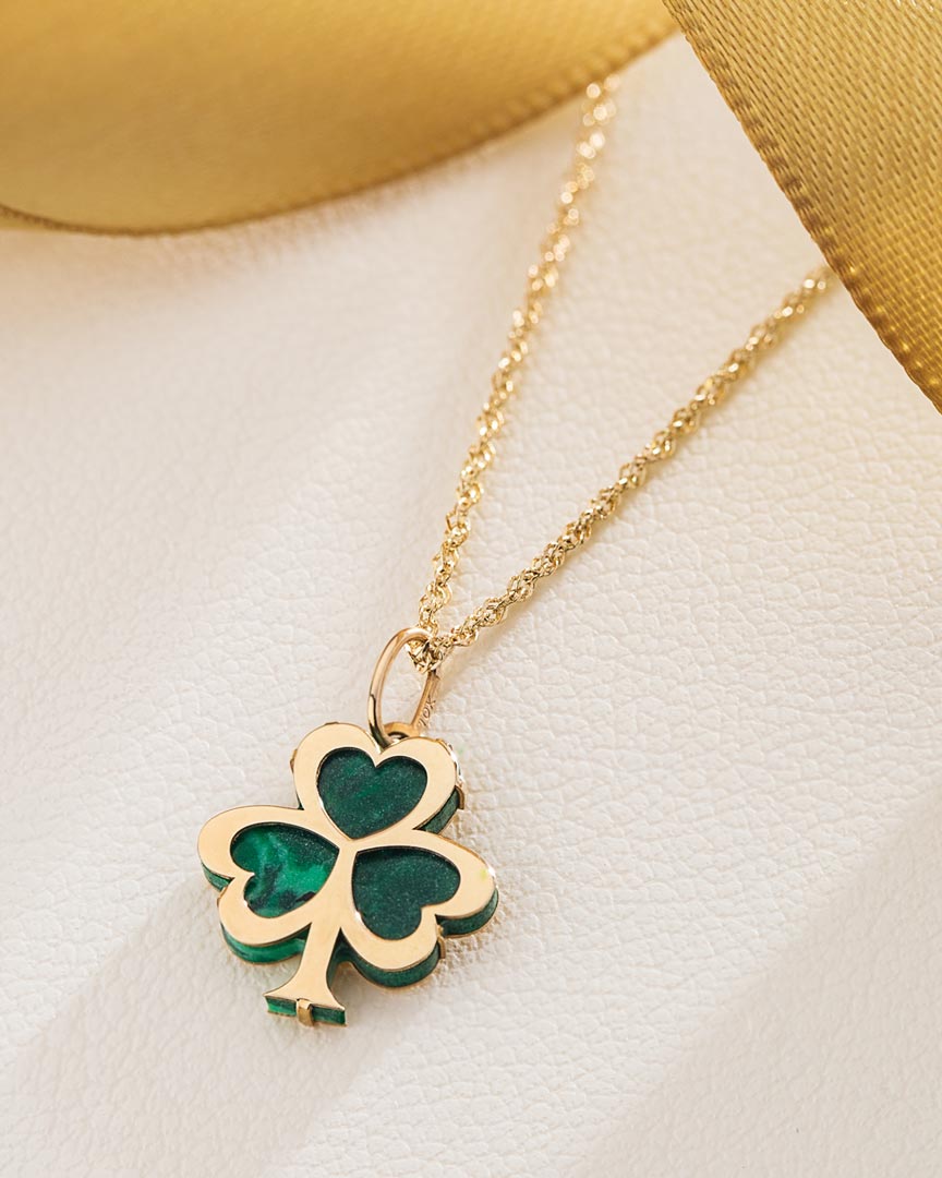 lifestyle image of malachite gold shamrock necklace from solvar