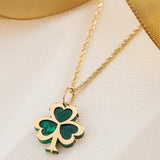 lifestyle image of malachite gold shamrock necklace from solvar